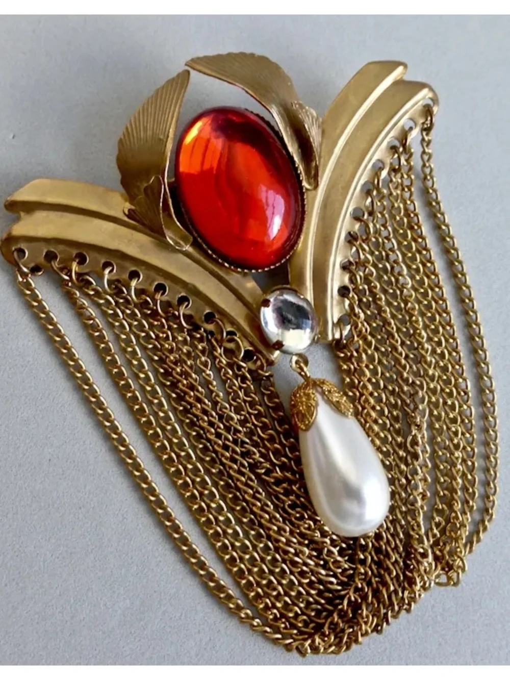 Large gold Tone Vintage Brooch w/Red Oval Stone, Faux Pearl Drop & chain Fringe.